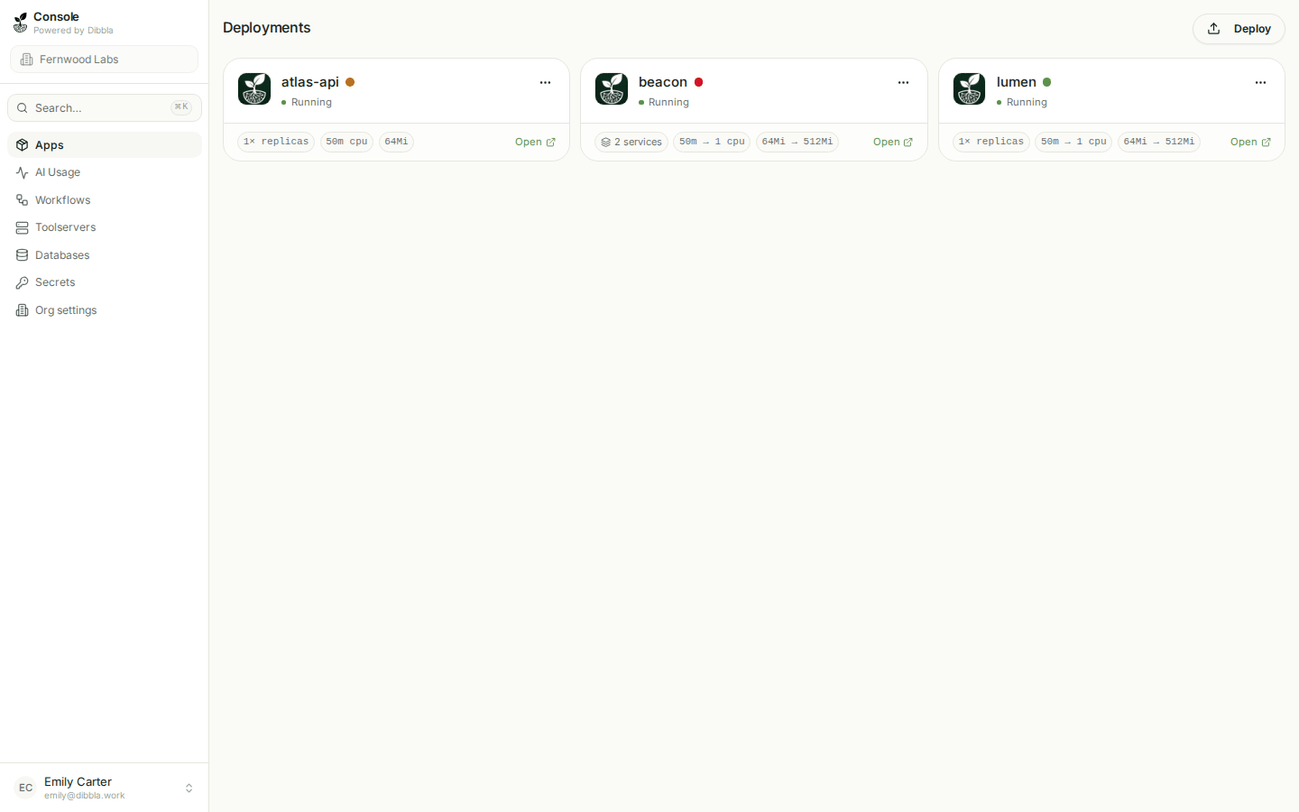 The deployments grid, each app card showing a review status dot beside its name