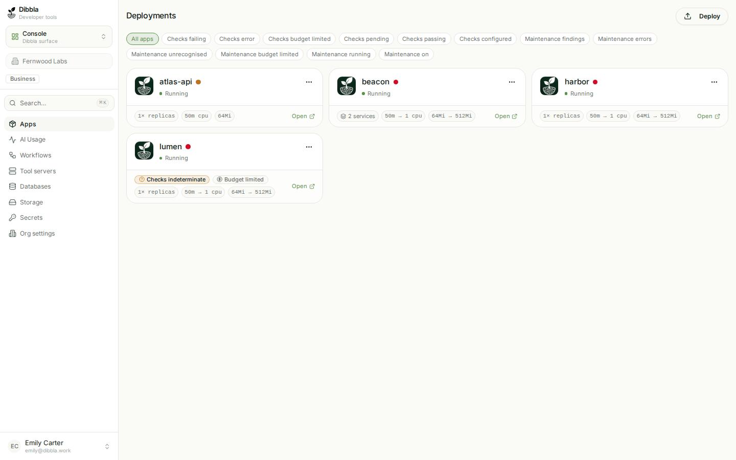 The deployments grid, each app card showing a review status dot beside its name